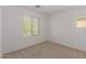 Carpeted bedroom with natural light coming from two windows at 20733 W Alsap Rd, Buckeye, AZ 85396