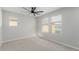 Bedroom with neutral walls, carpet, a ceiling fan, and two windows with blinds for natural light at 20733 W Alsap Rd, Buckeye, AZ 85396