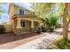 Charming two-story home featuring stone-accented columns and a well-maintained front yard at 20733 W Alsap Rd, Buckeye, AZ 85396