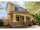 Attractive home showcasing a side view, front porch and complemented by lush greenery at 20733 W Alsap Rd, Buckeye, AZ 85396