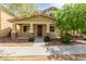 Charming two-story home featuring stone accents on the porch columns and a well-maintained front yard at 20733 W Alsap Rd, Buckeye, AZ 85396
