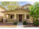Charming home with stone accents and a welcoming front porch, showcasing the attractive exterior design at 20733 W Alsap Rd, Buckeye, AZ 85396