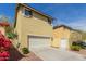 Exterior shot featuring a two-car garage, well-maintained landscaping, and a neutral-toned two-story home at 20733 W Alsap Rd, Buckeye, AZ 85396