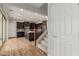 Gourmet kitchen featuring dark wood cabinetry, stainless steel appliances, and a center island with granite countertops at 20733 W Alsap Rd, Buckeye, AZ 85396