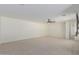 Expansive, carpeted main bedroom, includes large windows and a ceiling fan at 20733 W Alsap Rd, Buckeye, AZ 85396