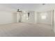 Spacious main bedroom has plush carpeting, neutral paint, ceiling fan, and multiple windows at 20733 W Alsap Rd, Buckeye, AZ 85396