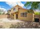 View of home's backyard with mature landscaping and ample seating space at 21840 N 41St St, Phoenix, AZ 85050