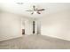 Neutral bedroom featuring plush carpet, ceiling fan and ample closet space at 21840 N 41St St, Phoenix, AZ 85050
