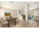 Dining area with modern table set and decor, seamlessly connecting to the living space at 21840 N 41St St, Phoenix, AZ 85050