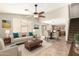 Open-concept layout with a ceiling fan and stylish furniture perfect for entertaining at 21840 N 41St St, Phoenix, AZ 85050