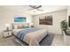 Bright main bedroom featuring a ceiling fan, neutral walls, and a plush rug at 21840 N 41St St, Phoenix, AZ 85050