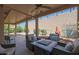 Charming backyard seating with comfortable chairs and a fire pit, ideal for outdoor entertaining and relaxation at 25639 S Beech Creek Dr, Sun Lakes, AZ 85248