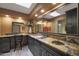 Well-lit bathroom with dual vanities, granite countertops, and ornate decor at 25639 S Beech Creek Dr, Sun Lakes, AZ 85248