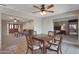 Bright dining area with table, adjacent to open living spaces and bedroom at 25639 S Beech Creek Dr, Sun Lakes, AZ 85248