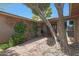 Inviting front entrance with a brick walkway, desert landscaping, and a cozy seating area at 25639 S Beech Creek Dr, Sun Lakes, AZ 85248