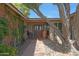 Elegant front entrance showcasing double doors, decorative accents, and lush desert landscaping at 25639 S Beech Creek Dr, Sun Lakes, AZ 85248