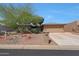 Charming single-story home featuring desert landscaping, a two-car garage, and a welcoming front entrance at 25639 S Beech Creek Dr, Sun Lakes, AZ 85248