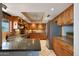 Bright open kitchen featuring wooden cabinets, tile flooring and stainless steel appliances at 25639 S Beech Creek Dr, Sun Lakes, AZ 85248