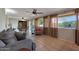 Spacious living area with tile flooring, large windows, and seamless transition to dining space at 25639 S Beech Creek Dr, Sun Lakes, AZ 85248