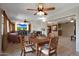 Open-concept living space with dining area, TV, and comfortable seating at 25639 S Beech Creek Dr, Sun Lakes, AZ 85248