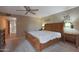 Comfortable main bedroom with neutral walls, wooden furniture, and ample natural light at 25639 S Beech Creek Dr, Sun Lakes, AZ 85248