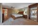 Spacious main bedroom with carpet, neutral walls, wooden furniture, and seamless transition to dining area at 25639 S Beech Creek Dr, Sun Lakes, AZ 85248