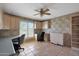 Spacious office featuring built-in cabinets, desks, and natural light from a window at 25639 S Beech Creek Dr, Sun Lakes, AZ 85248