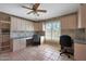 Office offers built-in cabinetry, two work stations and tiled floor at 25639 S Beech Creek Dr, Sun Lakes, AZ 85248