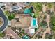 Expansive property with a sparkling pool, basketball court, and multiple patio areas, surrounded by lush landscaping at 30129 N 52Nd Pl, Cave Creek, AZ 85331