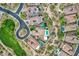 Aerial view of a neighborhood highlighting the home's pool, basketball court, and well-manicured landscaping at 30129 N 52Nd Pl, Cave Creek, AZ 85331
