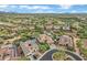 Expansive aerial view of a desert community featuring custom homes, pools, and lush desert landscaping at 30129 N 52Nd Pl, Cave Creek, AZ 85331