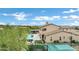 Aerial view showcasing the expansive backyard with a pool, basketball court, firepit, and trampoline at 30129 N 52Nd Pl, Cave Creek, AZ 85331