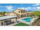 A luxurious backyard featuring a pool, spa, covered patio, and meticulously landscaped grounds, perfect for entertaining at 30129 N 52Nd Pl, Cave Creek, AZ 85331