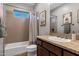 Neutral bathroom with tiled walls, granite countertop and a shower-tub combo at 30129 N 52Nd Pl, Cave Creek, AZ 85331