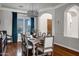 Elegant dining room with hardwood floors, a modern chandelier, and seating for eight near large windows at 30129 N 52Nd Pl, Cave Creek, AZ 85331