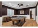 Cozy game room with a billiard table, hardwood floors, and leather seating with wainscoting at 30129 N 52Nd Pl, Cave Creek, AZ 85331