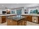 Open kitchen with a large island, stainless steel appliances, granite countertops, and seamless flow to outdoor dining at 30129 N 52Nd Pl, Cave Creek, AZ 85331