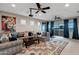 Inviting living room showcasing contemporary furnishings, ceiling fan, and colorful throw pillows at 30129 N 52Nd Pl, Cave Creek, AZ 85331