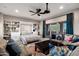 Versatile living space with Murphy bed, custom built-ins, cozy seating, and patio access at 30129 N 52Nd Pl, Cave Creek, AZ 85331