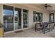 Covered patio with seating area, dining table, and view of the pool at 30129 N 52Nd Pl, Cave Creek, AZ 85331