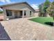 Inviting backyard featuring a patio, artificial grass, and ample space for outdoor entertainment and relaxation at 3013 S 102Nd Ln, Tolleson, AZ 85353