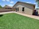 Backyard featuring artificial grass and block wall for privacy at 3013 S 102Nd Ln, Tolleson, AZ 85353