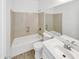 This bathroom features a white bathtub, shower, shower head, and controls at 3013 S 102Nd Ln, Tolleson, AZ 85353