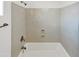 This bathroom features a white bathtub, shower, shower head, and controls at 3013 S 102Nd Ln, Tolleson, AZ 85353