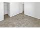 This bedroom features neutral paint and tile, with a door to a closet and additional rooms at 3013 S 102Nd Ln, Tolleson, AZ 85353