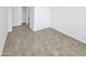 This bedroom features neutral paint and tile, with a door to a closet and en-suite bathroom at 3013 S 102Nd Ln, Tolleson, AZ 85353