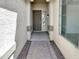 Welcoming entryway with a covered porch, offering a charming first impression and shelter from the elements at 3013 S 102Nd Ln, Tolleson, AZ 85353