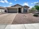Charming single-story home with a well-maintained yard and a two-car garage in a quiet neighborhood at 3013 S 102Nd Ln, Tolleson, AZ 85353
