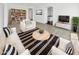 Bright living room featuring contemporary decor, stylish furniture, and an open layout for comfortable living at 3013 S 102Nd Ln, Tolleson, AZ 85353