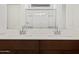 Close up of bathroom double vanity featuring quartz countertop, sinks, and modern faucets at 37126 W Prado St, Maricopa, AZ 85138